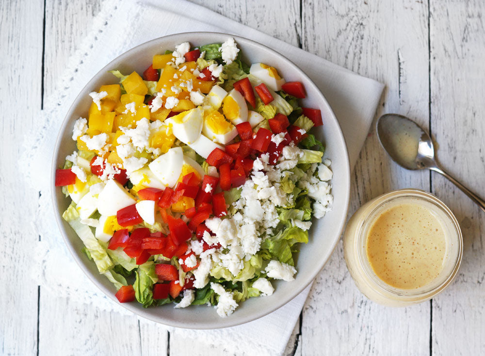 Chopped salad with egg, tomato and greens