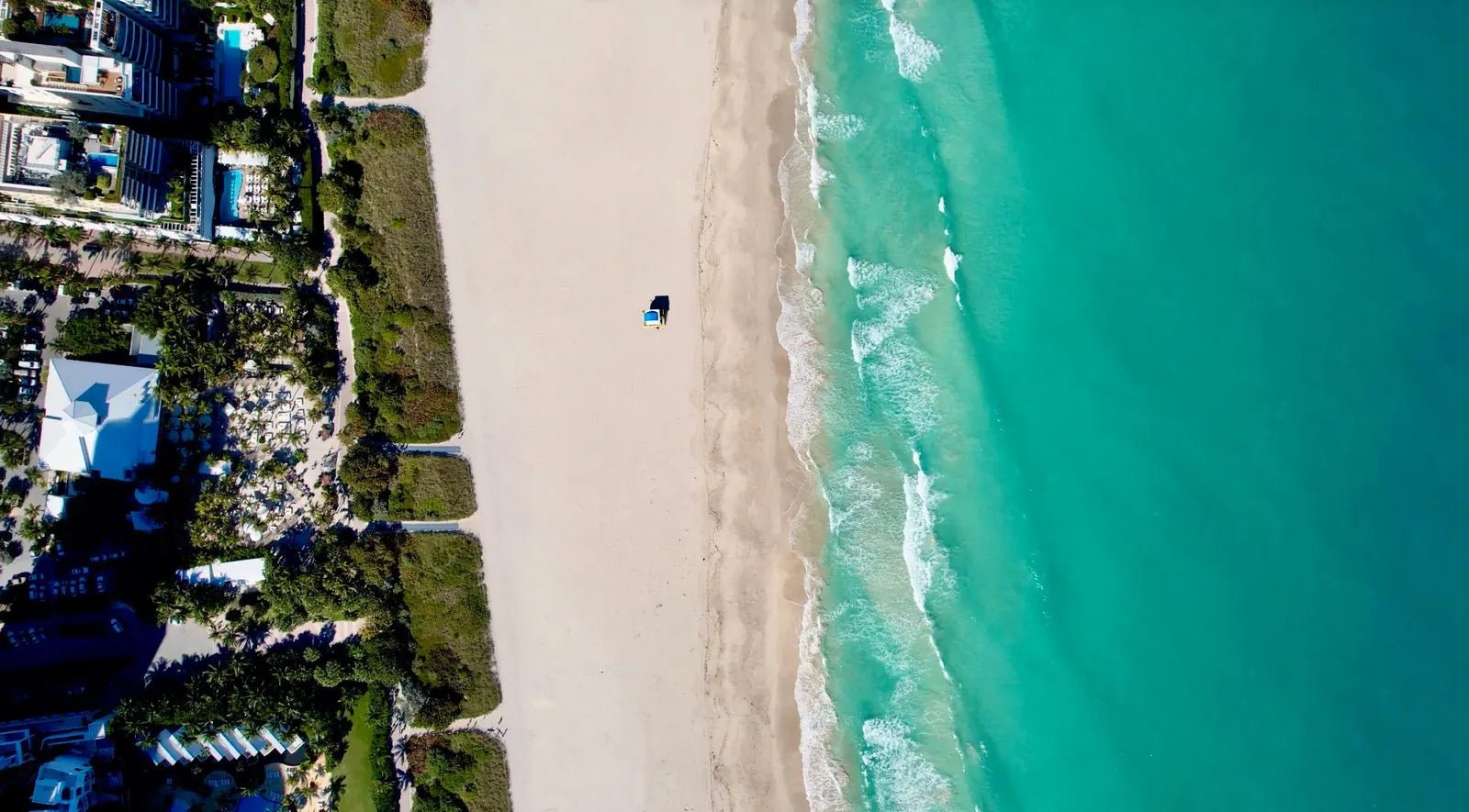 Aerial view of turquoise water along the Miami Beach coastline