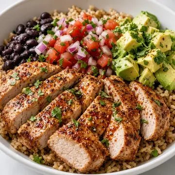 Sliced chicken breast bowl with black beans, avocado and corn